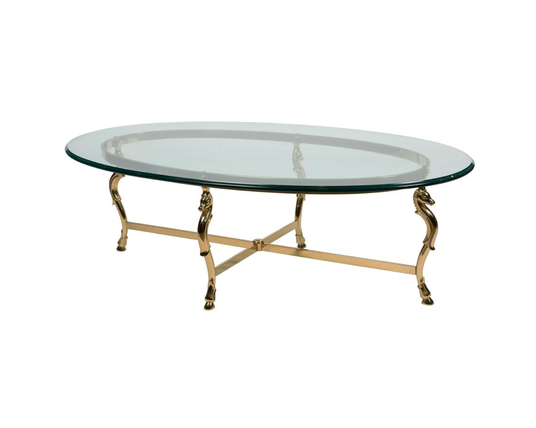 Brass and Glass Seahorse Coffee Table: Description - A brass and glass seahorse coffee table. Dimensions - 16" x 52" x 32"