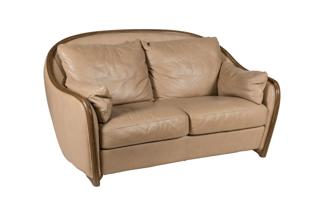Natuzzi Leather Loveseat: Description - A Natuzzi leather loveseat. Dimensions - 36" x 66" x 38"