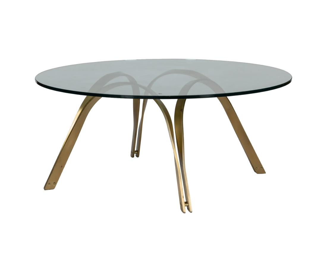 Gilt Iron and Glass Coffee Table: Description - A gilt iron and glass coffee table. Dimensions - 18" x 42"