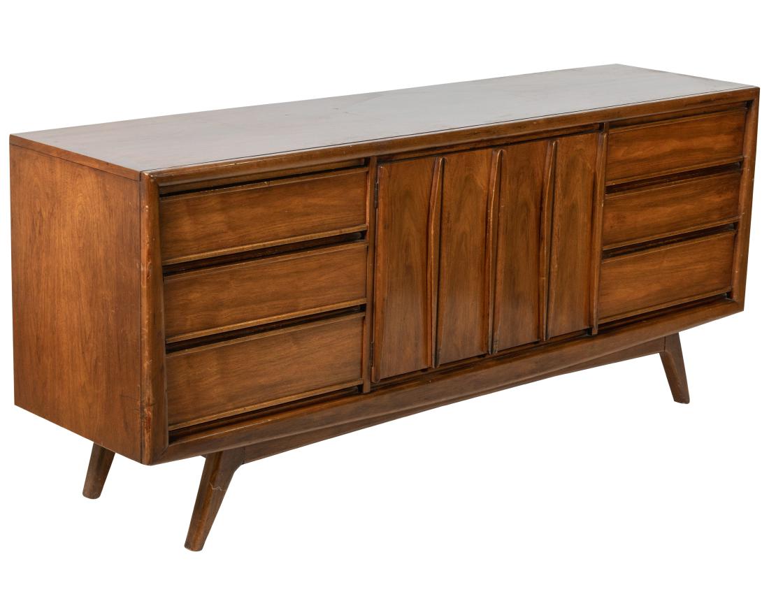 Walnut Credenza: Description - Walnut credenza with sculpted metal doors. Dimensions - 32" x 74" x 19"