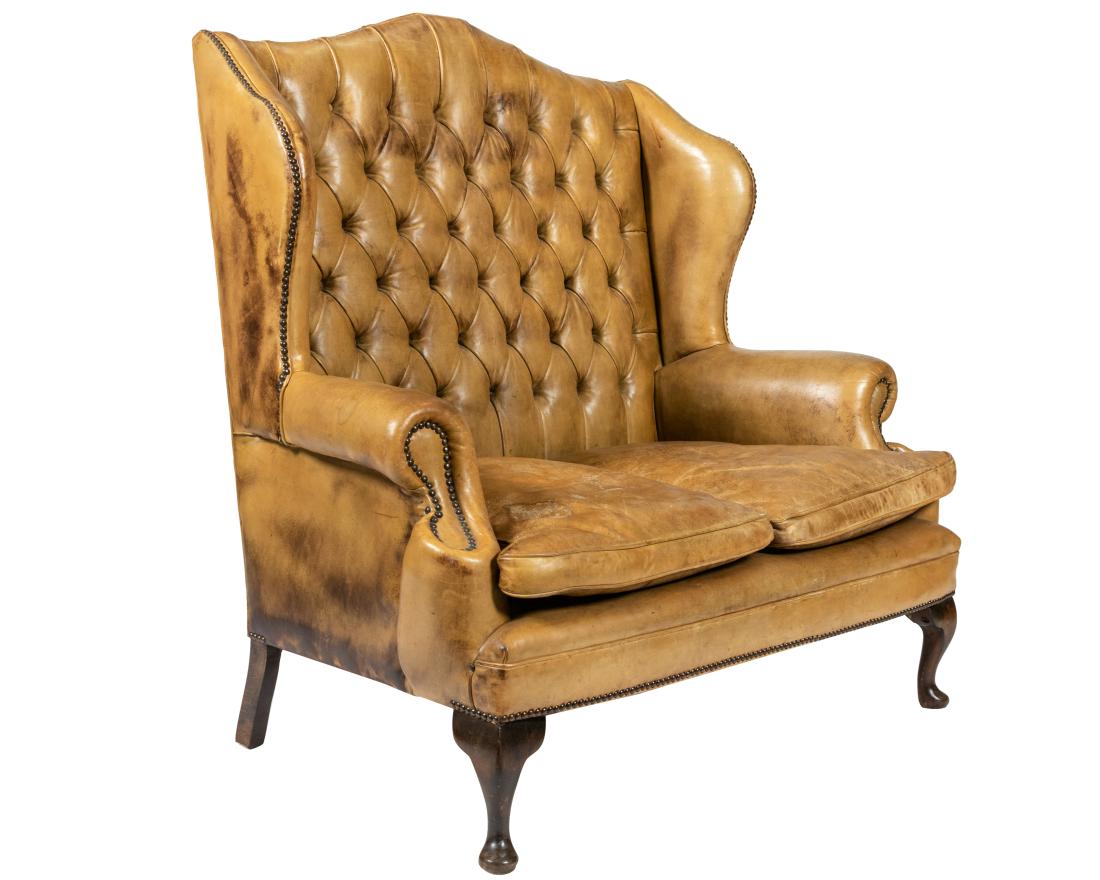 English Leather Wing Loveseat: Description - English leather tufted wing loveseat. Dimensions - 47" x 48" x 32"