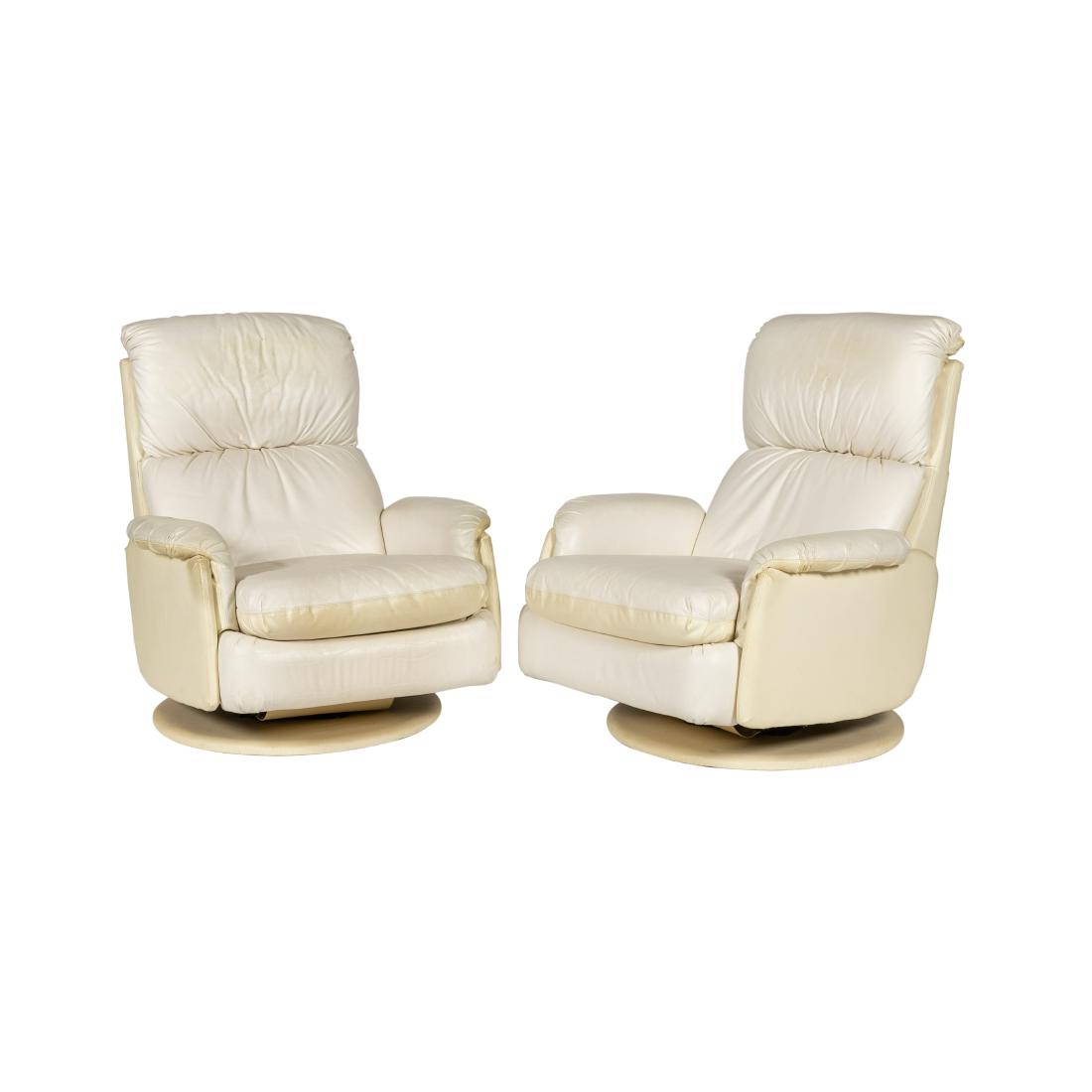 Pair Leather Swivel Recliners: Description - Pair of leather swivel recliners. Dimensions - 38" x 33" x 39"