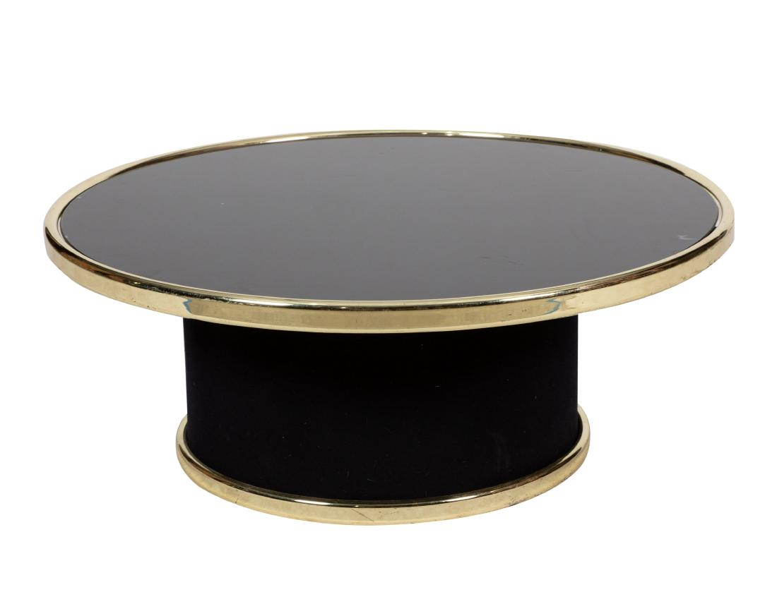 Smoked Glass Coffee Table: Description - Smoked glass and brass coffee table Dimensions - 13" x 33"