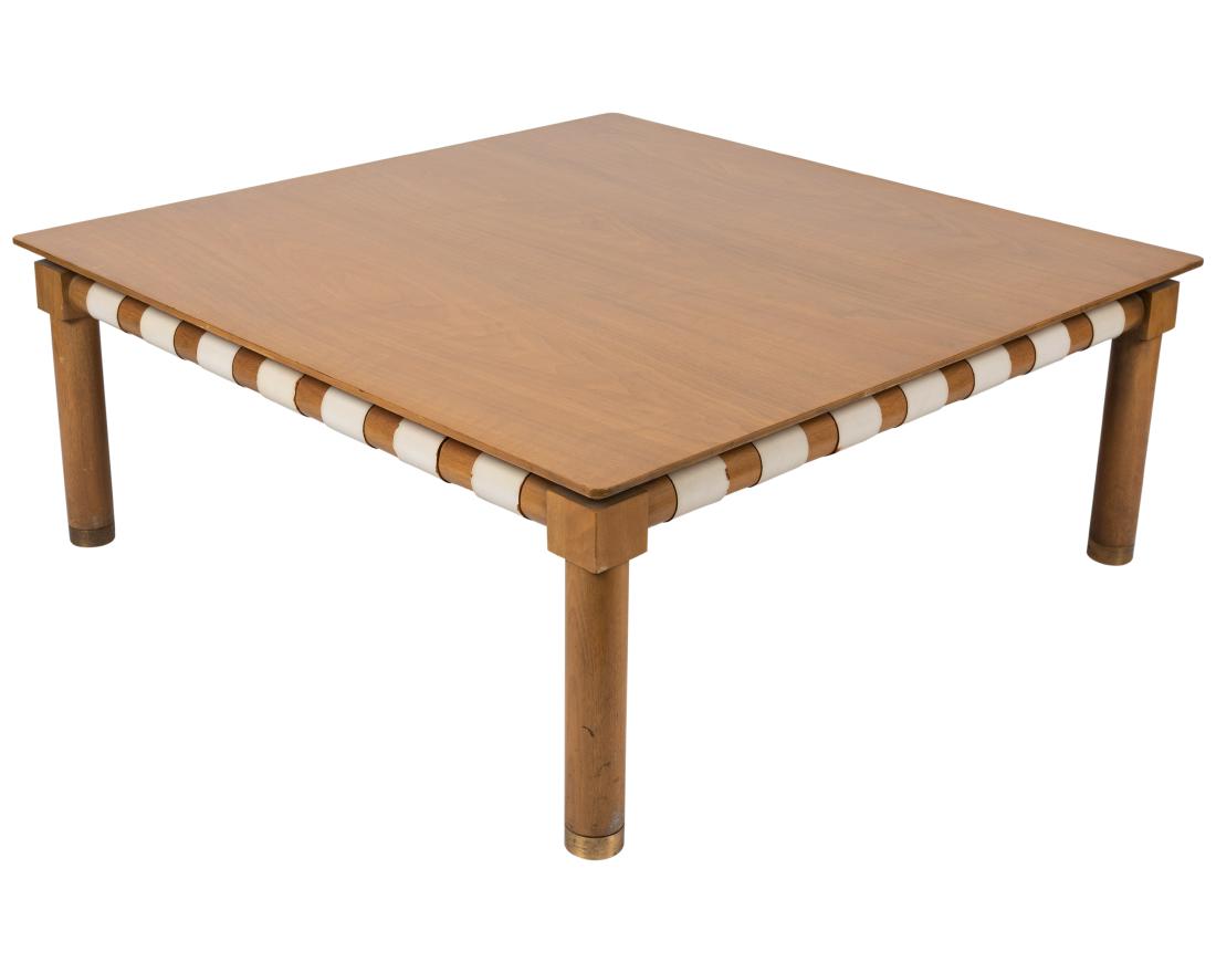 John Stuart - Walnut - Coffee Table: Description - John Stuart walnut coffee table with brass feet and leather straps. Dimensions - 17" x 42" x 42"