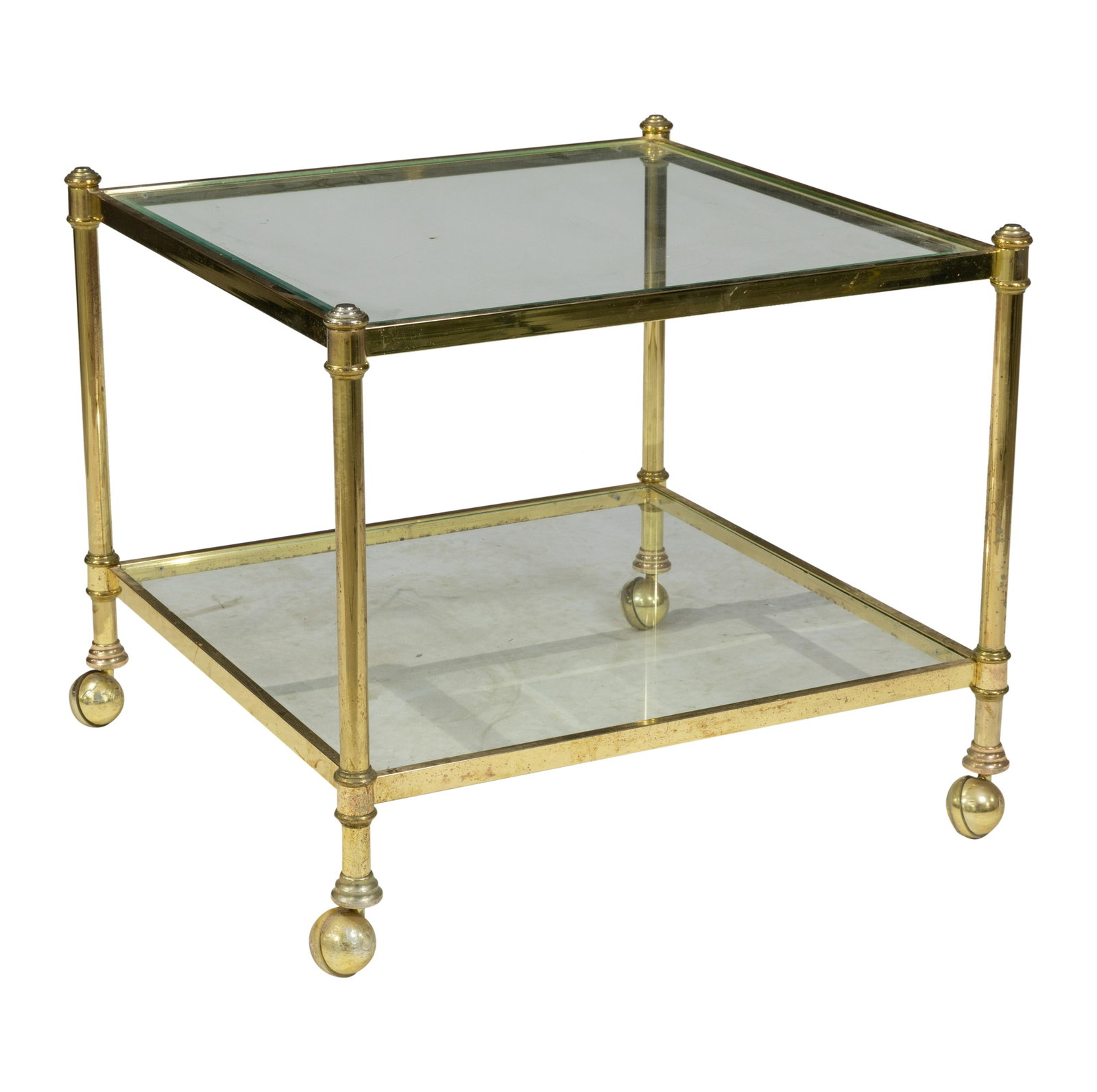 Two Tier Brass and Glass Table: Description - Two tier brass and glass table. Dimensions - 23" x 26"