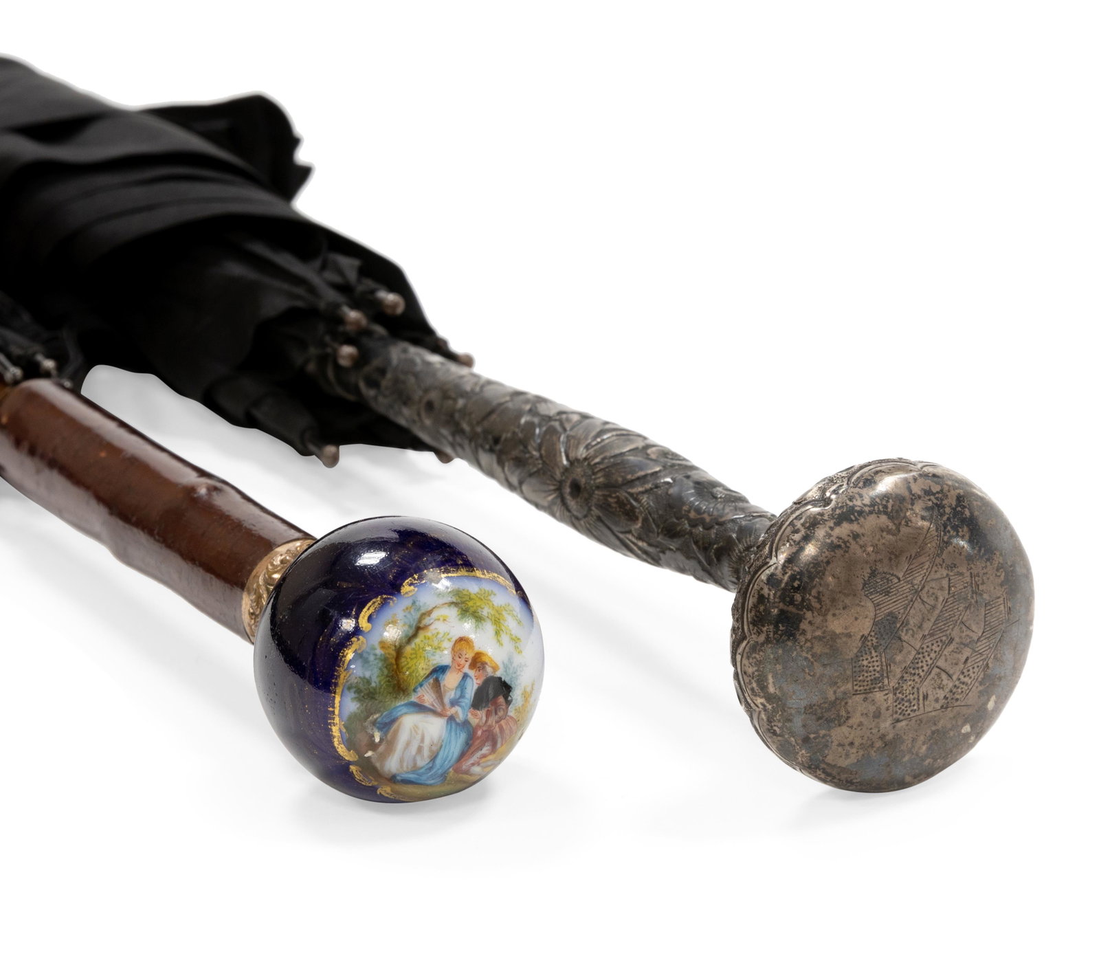 Two Umbrellas: Description - Two umbrellas one sterling one porcelain. Dimensions - 35" long sterling handle -8"