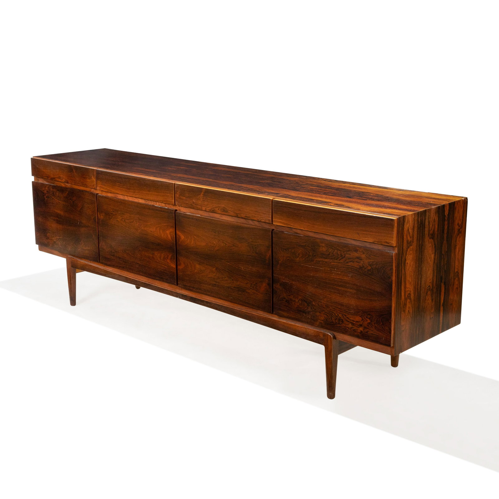 lb Kofod Larsen - Faarup - Rosewood Credenza: Description - Kofod Larsen rosewood credenza for Faarup Mobelfabrik. Dimensions - 30" x 90.5" x 19.5"