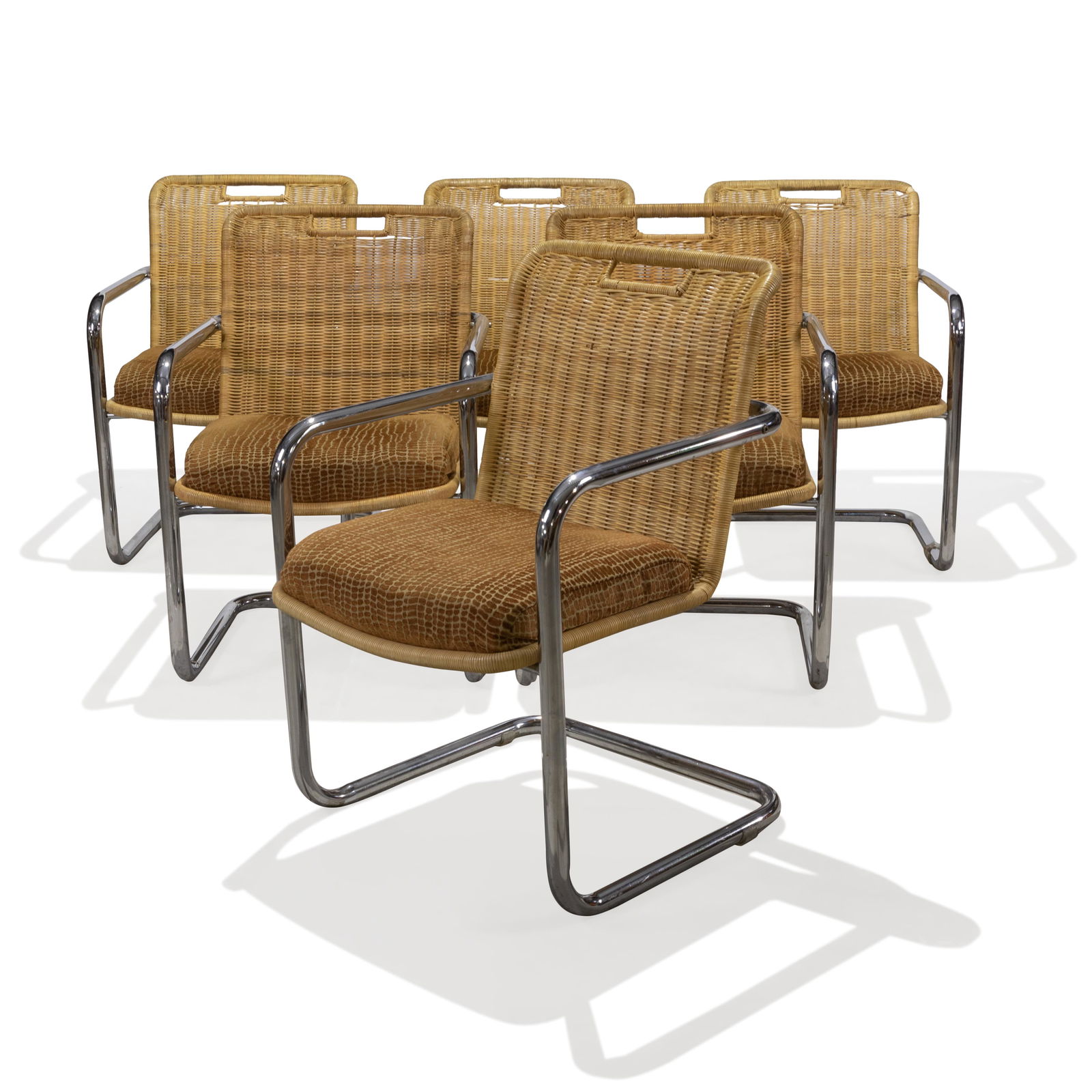 Chromcraft - Wicker Dining Chairs: Description - A set of 6 cantilevered dining chairs by Chromcraft. Dimensions - 34" x 22" x 24"