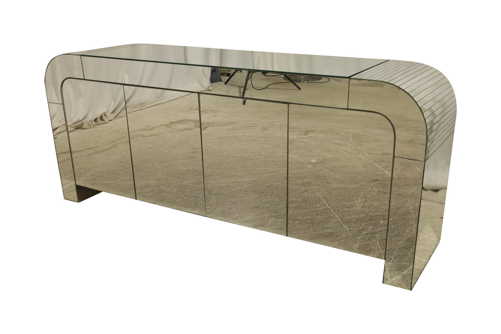 1980's Mirror Credenza: A 1980's waterfall mirrored credenza Dimensions:30x72x18