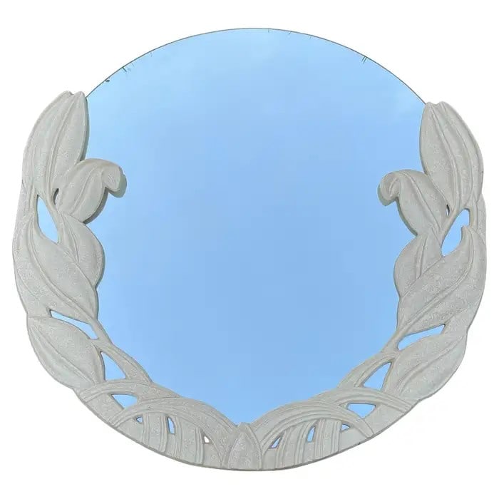 Sculpted Orchid Motif Mirror: An ivory sculpted orchid motif mirror Dimensions:44" Round