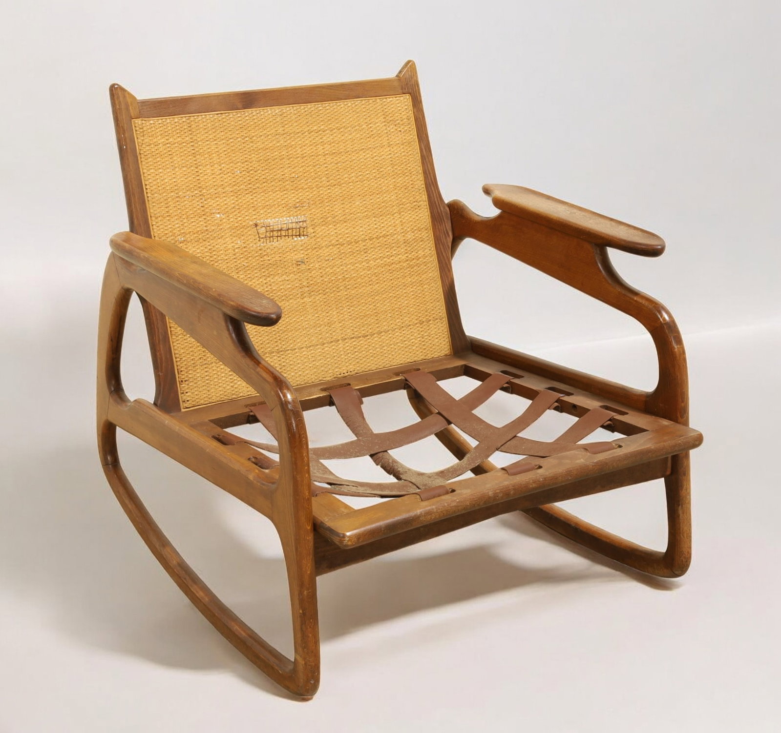 Italian Mid Century Sculpted Rocking Chair: An Italian mid century modern sculpted rocking chair Dimensions:28x28x28