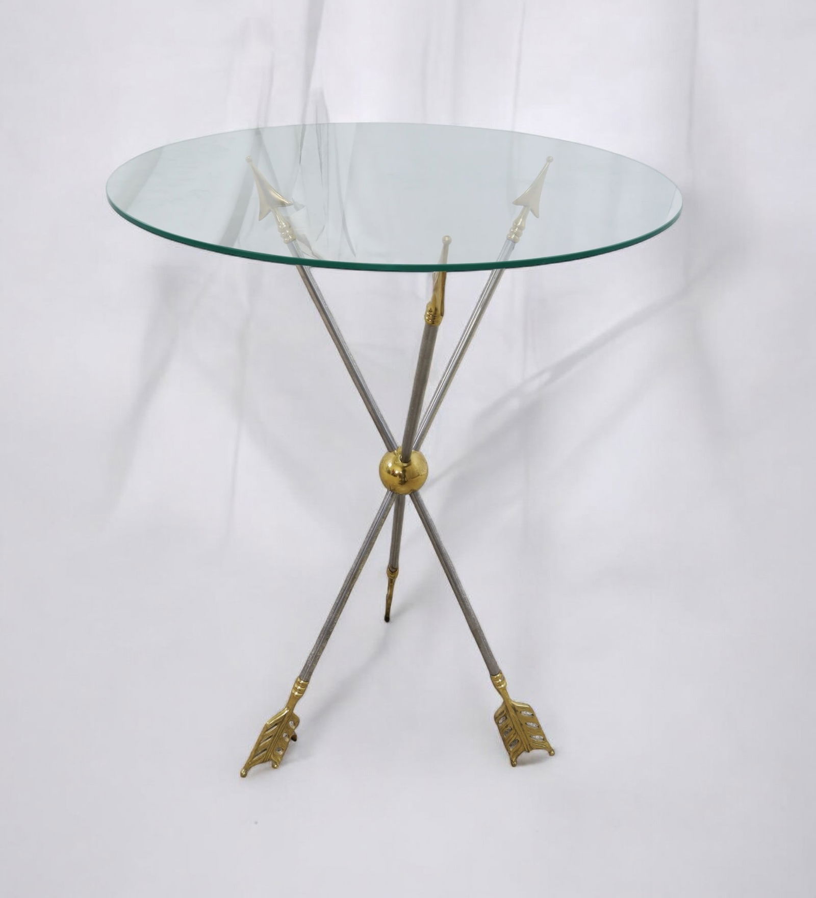A Maison Jansen Arrow Base Table: Maison Jansen brass and steel arrow table Dimensions:29x22