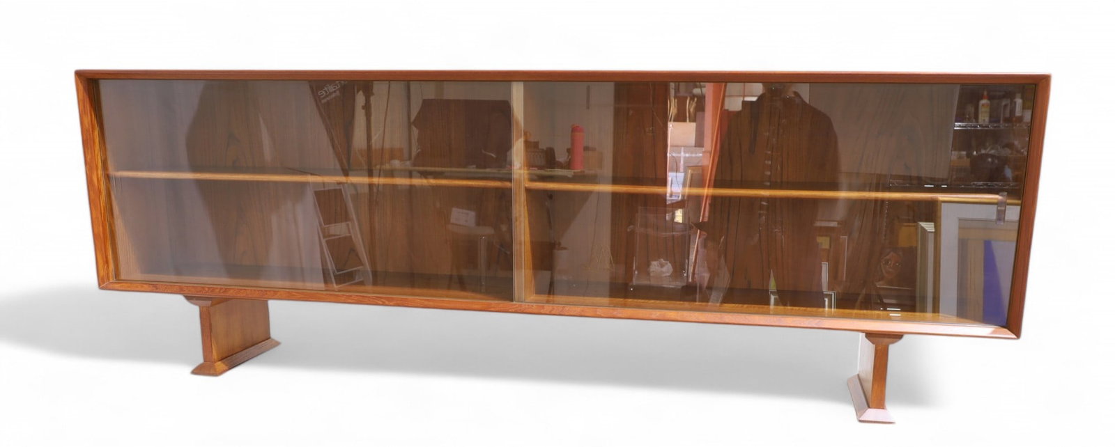 Dyrlund Teak Bookcase: A Danish Dyrlund teak bookcase with sliding glass doors Dimensions:24.5x71x12