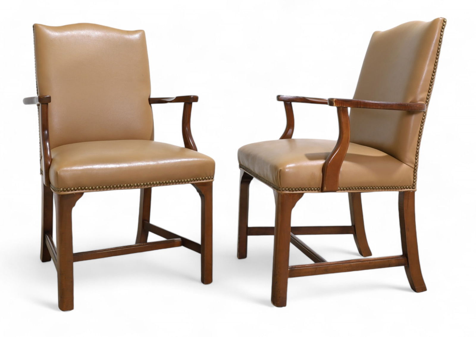 Southwood Arm Chairs - Pair: A pair of Southwood arm chairs with nail head trim and vinyl upholstery Dimensions:39x24x24