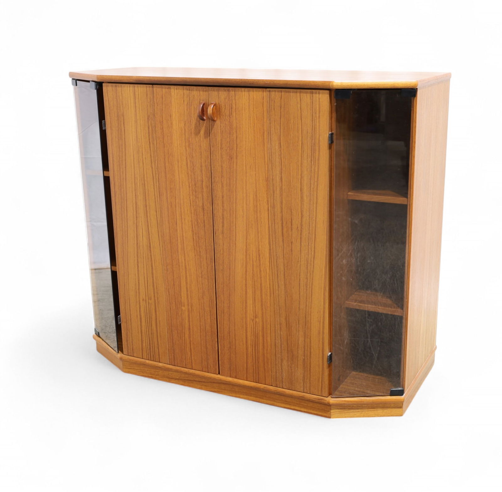Danish Teak TV Cabinet: A Danish teak tv cabinet with smoked glass corner doors on casters Dimensions:40x45x20