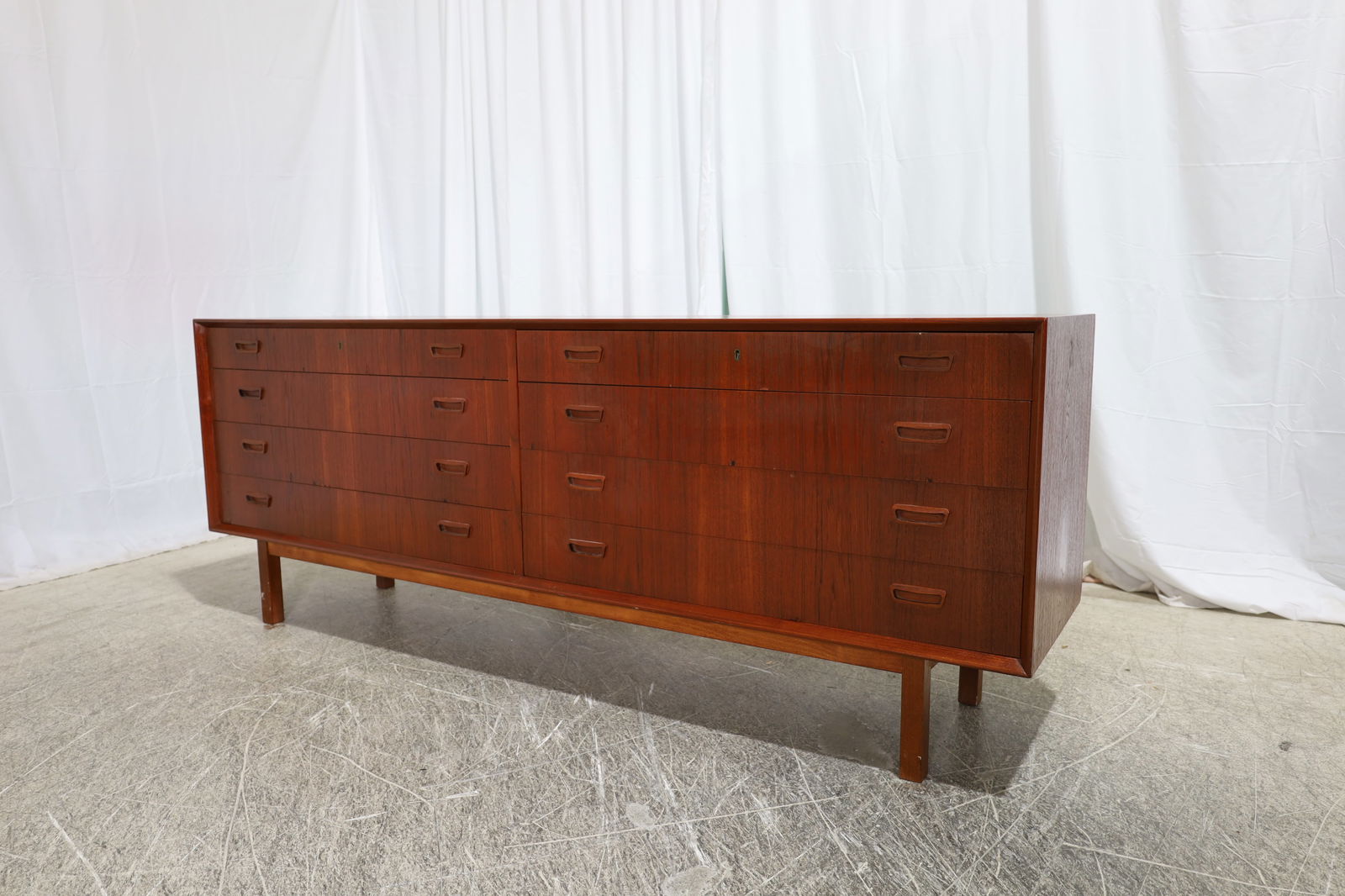 Peter Hvidt & Orla Molegaard Teak Credenza: A Peter Hvidt and Orla Molegaard teak 8 drawer credenza Dimensions:30x78x18