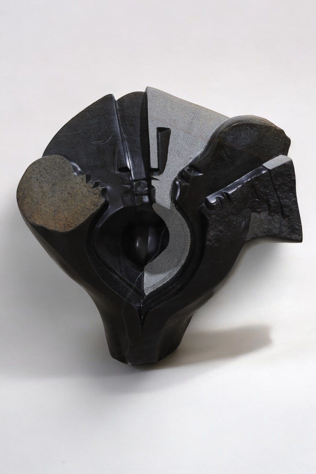 Tendai Mukomberanwa - Springstone Sculpture: A springstone serpentine Zimbabwean sculpture by artist Tendai Mukomberanwa, titled Having Conversation Dimensions:25x27x10