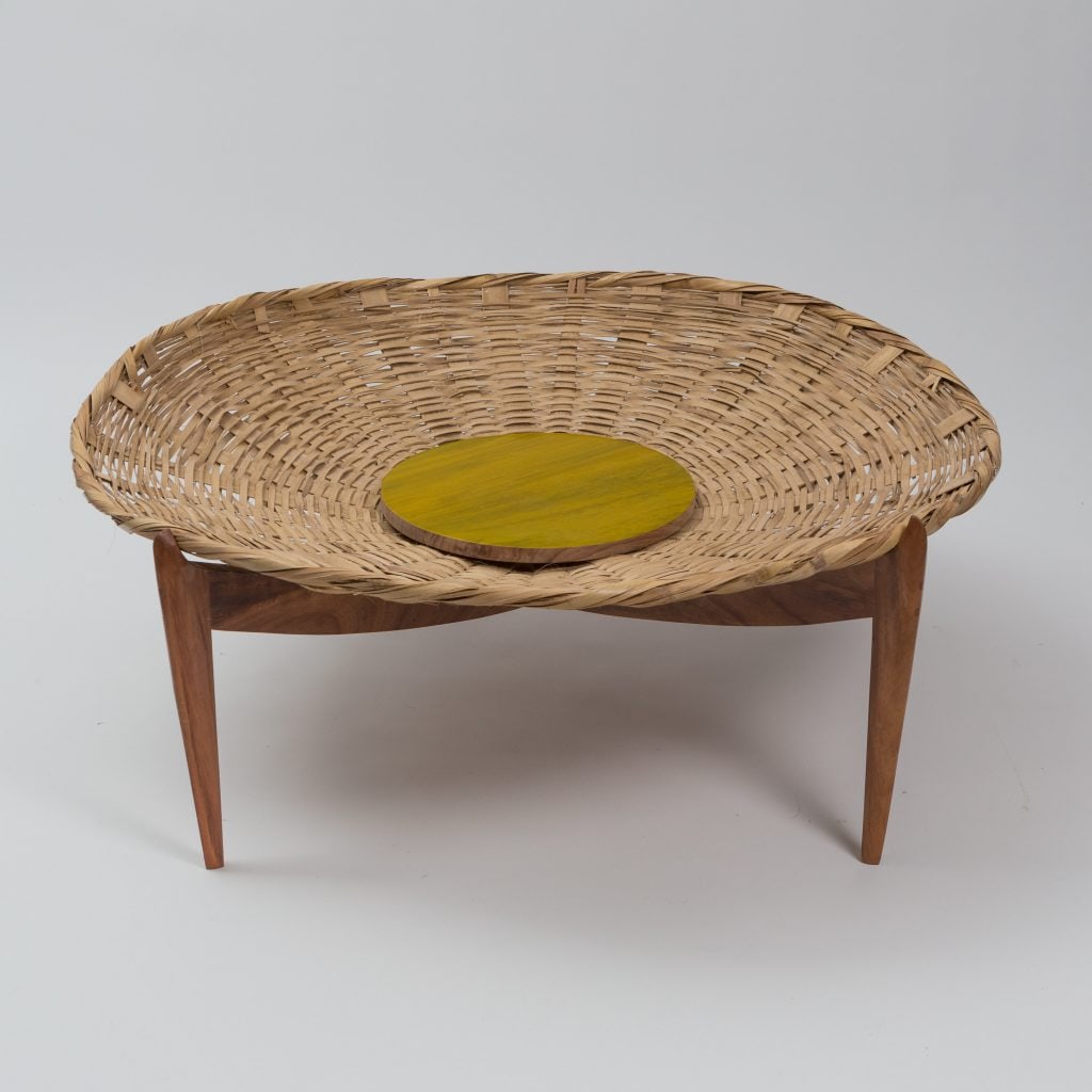 Solaria Mesa Basket Table: Solaria Mesa canasta/ basket table designed by A Solaria mesa basket table handmade by Gabriela Valenzuela-Hirsch . Almendro wood crossed legs and Guanacaste wood top platter Dimensions:18.5x47.5