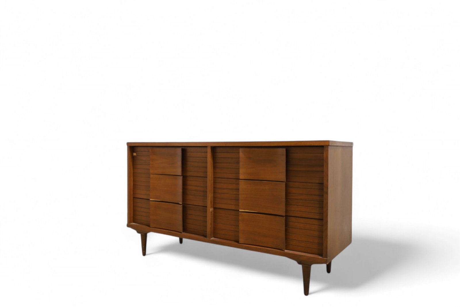 Johnson Carper Mid Century Dresser: A Johnson Carper 6 drawer long dresser with sculpted fronts Dimensions:30x54x18