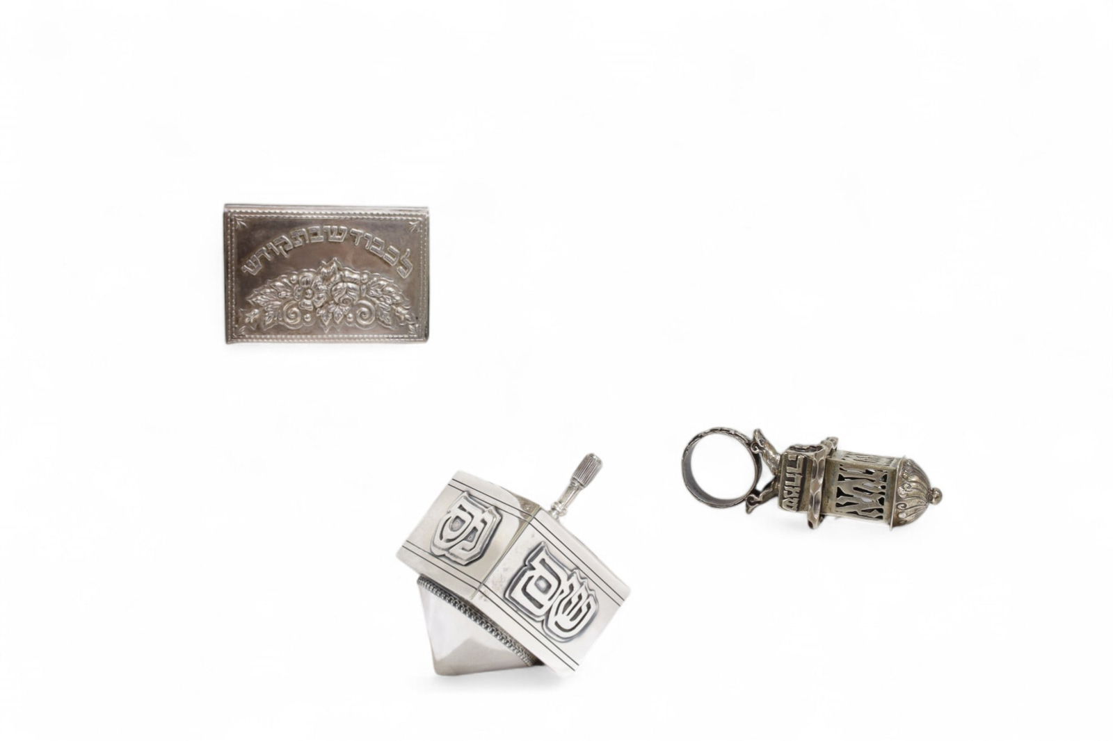 Sterling Judaica Pieces - 3: Three sterling silver Judaica pieces, includes wedding ring, dreidel, and match safe with vintage matches Dreidel Dimensions:3x2 Ring Dimensions:2.5" H Match Dimensions:1.5x2.25