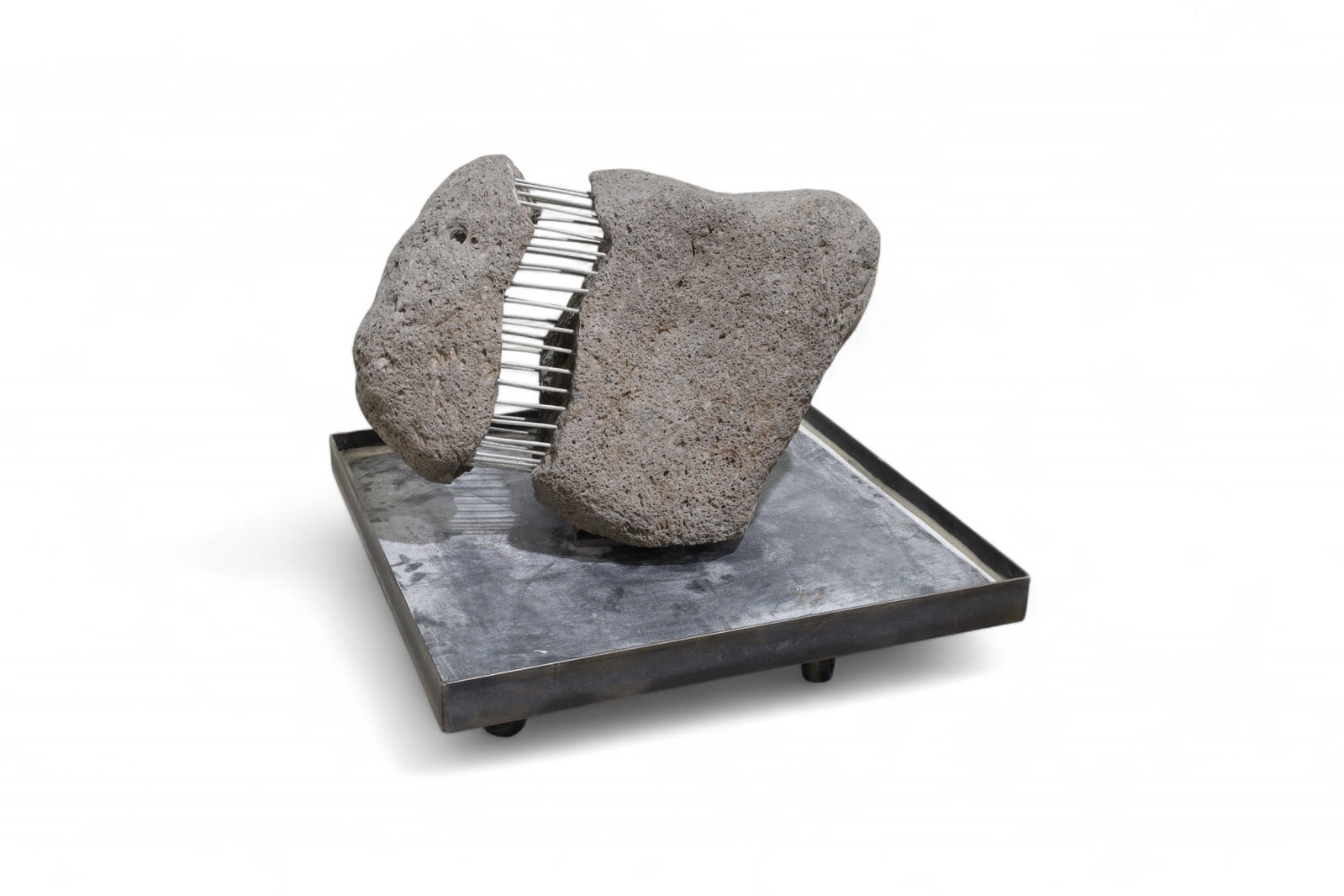 Stone & Wire Sculpture: A stone and wire sculpture on iron base Dimensions:16x23x23