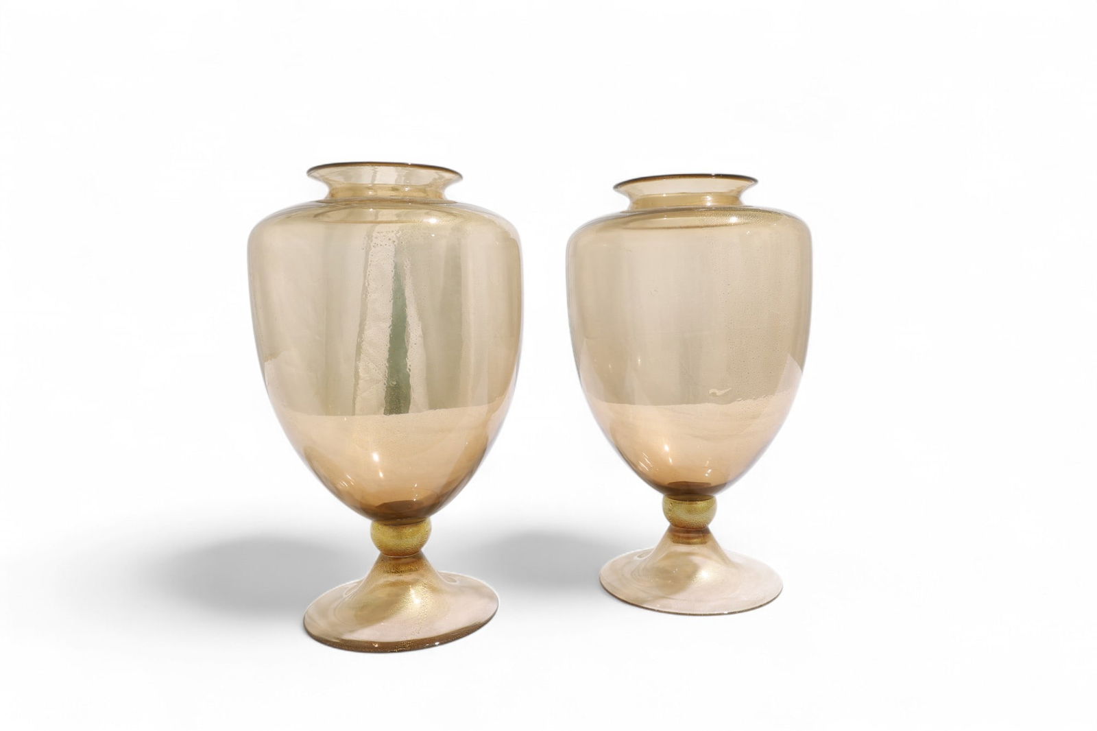 Donghia Amber Gold Vases - Pair: A pair of amber gold Donghia vases with gold flecking Dimensions:13x8.5