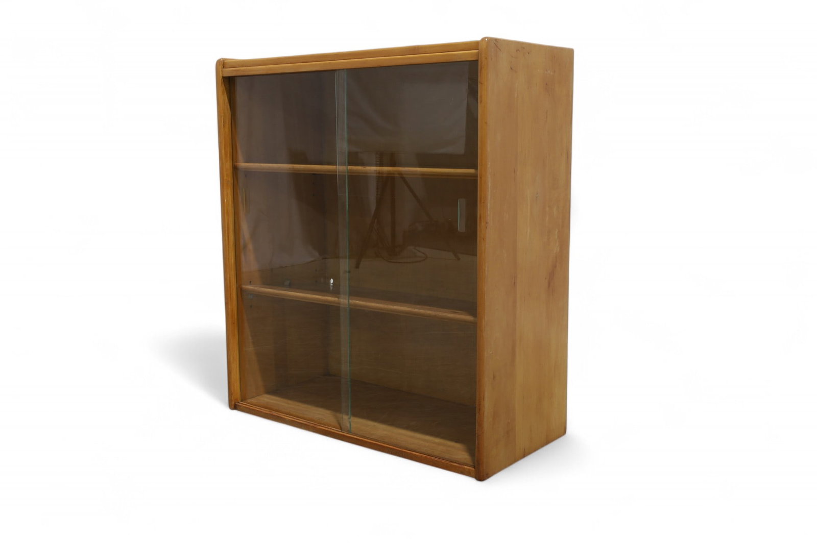 1950's Birch Bookcase: A 1950's birch bookcase with glass doors Dimensions:35x30.5x14