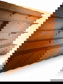 Hansen & Guldborg Denmark Teak Wall Unit: A 6 bay signed Hansen & Guldborg (HG) Denmark teak wall unit. Includes:7 78" in. posts 3 back panels 3 19x35x16 cabinets 3 16x35x12 cabinets 2 drawer desk 9 12x35 shelves 5 9x35