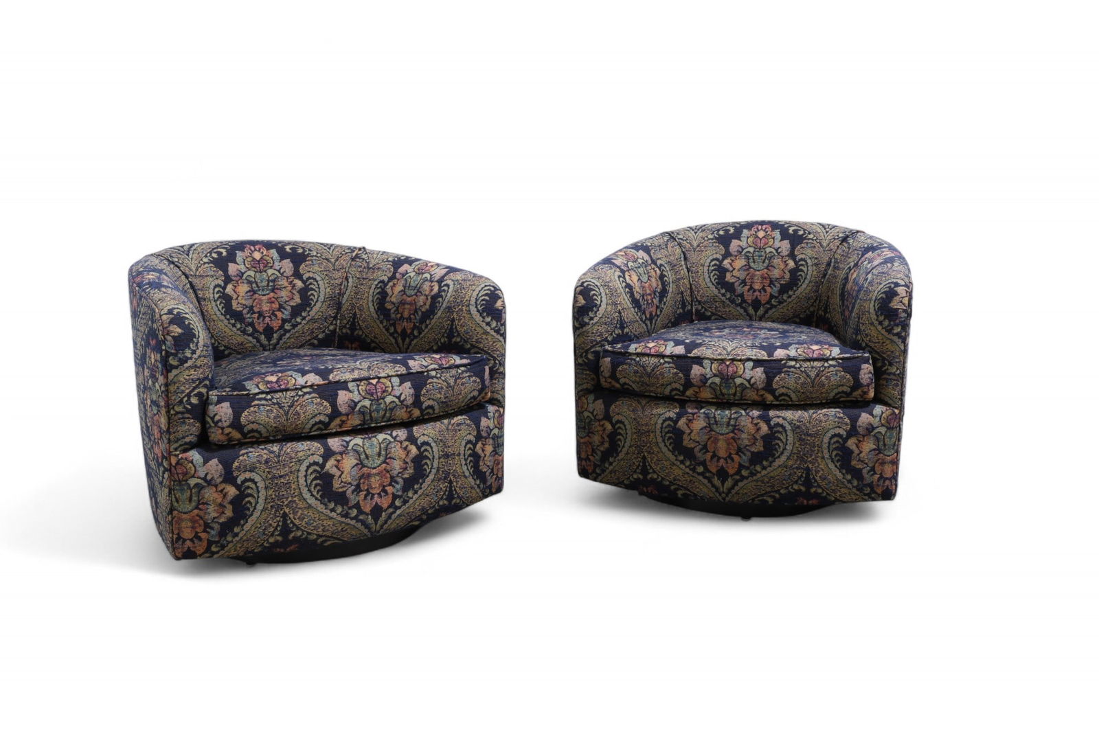 Milo Baughman (Attr.) Swivel Chairs - Pair: A pair of Milo Baughman attributed swivel chairs in original upholstery on ebonized wood bases Dimensions:24x28x27 Seat Height:16