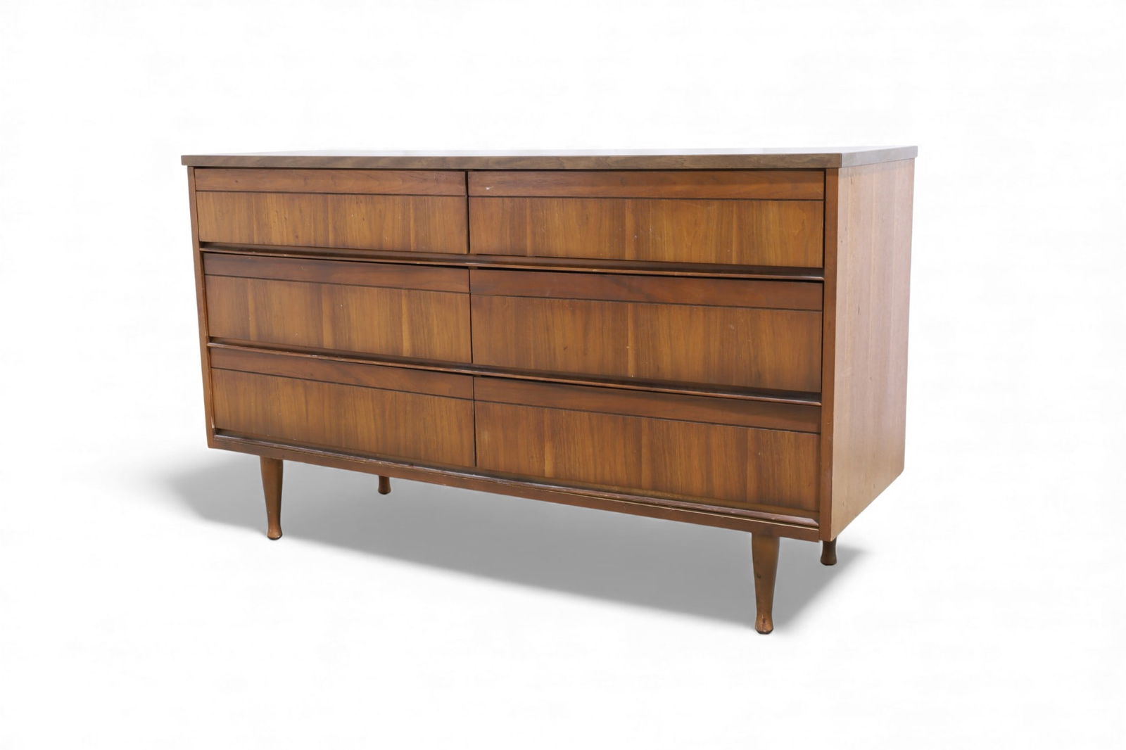 Mid Century Walnut 6 Drawer Dresser: A mid century modern walnut 6 drawer dresser with peg legs and laminate top