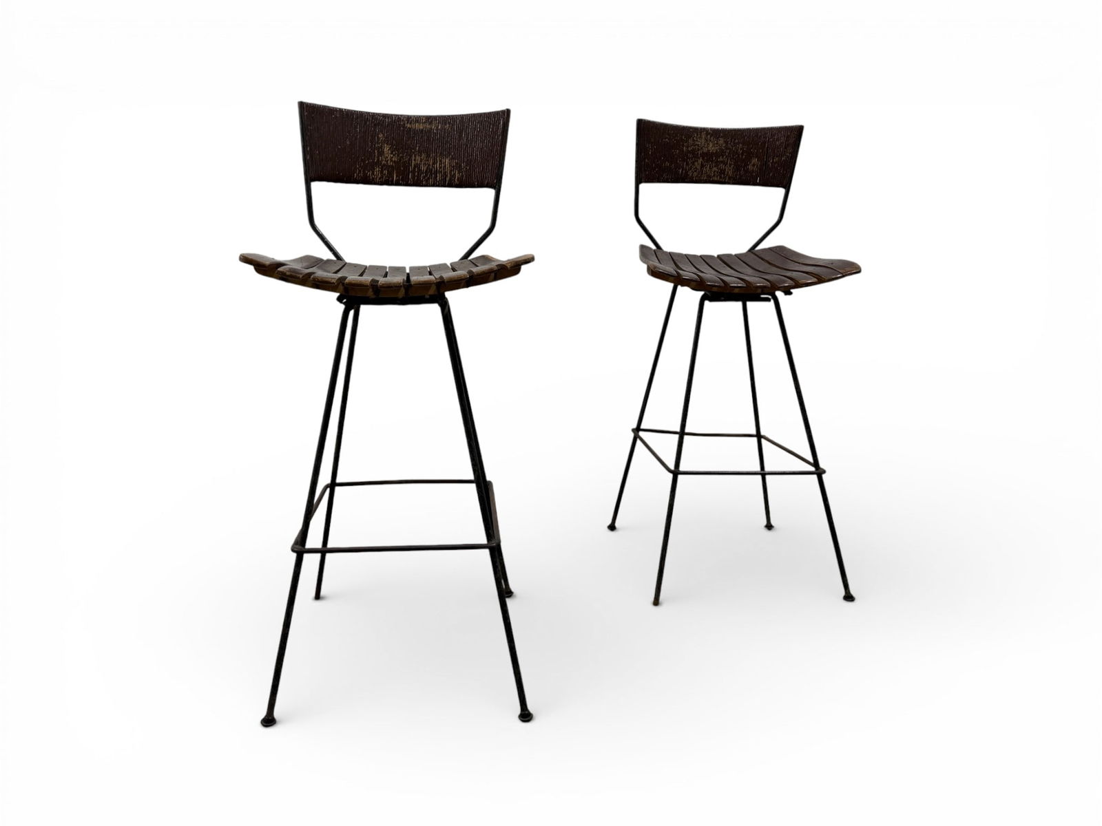 Vintage Arthur Umanoff Stools | Pair: A pair of vintage Arthur Umanoff stools with iron frames, wood slat seats and paper cord backs. H:41" W:17" D:16" Seat Height: 28.5"