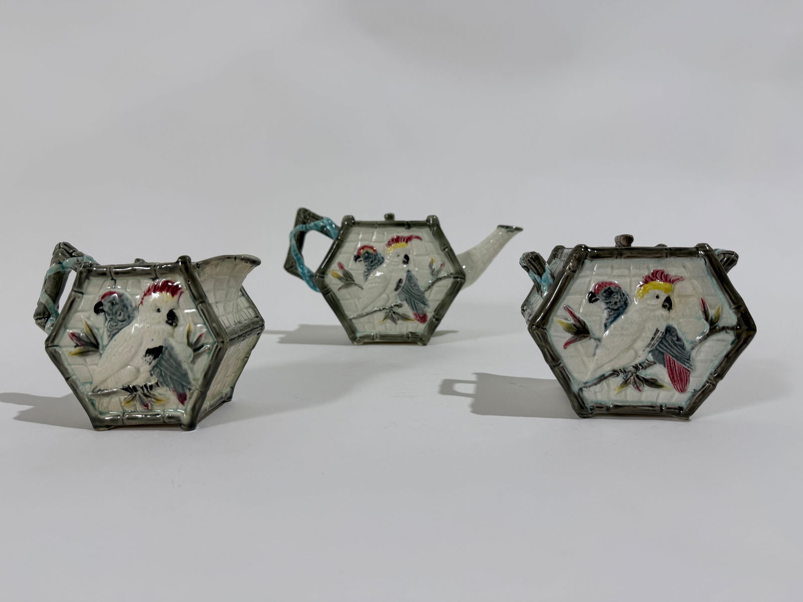 3 Piece Majolica Tea Set: A 3 Piece vintage Majolica tea set. Includes a tea pot, milk & sugar bowl.