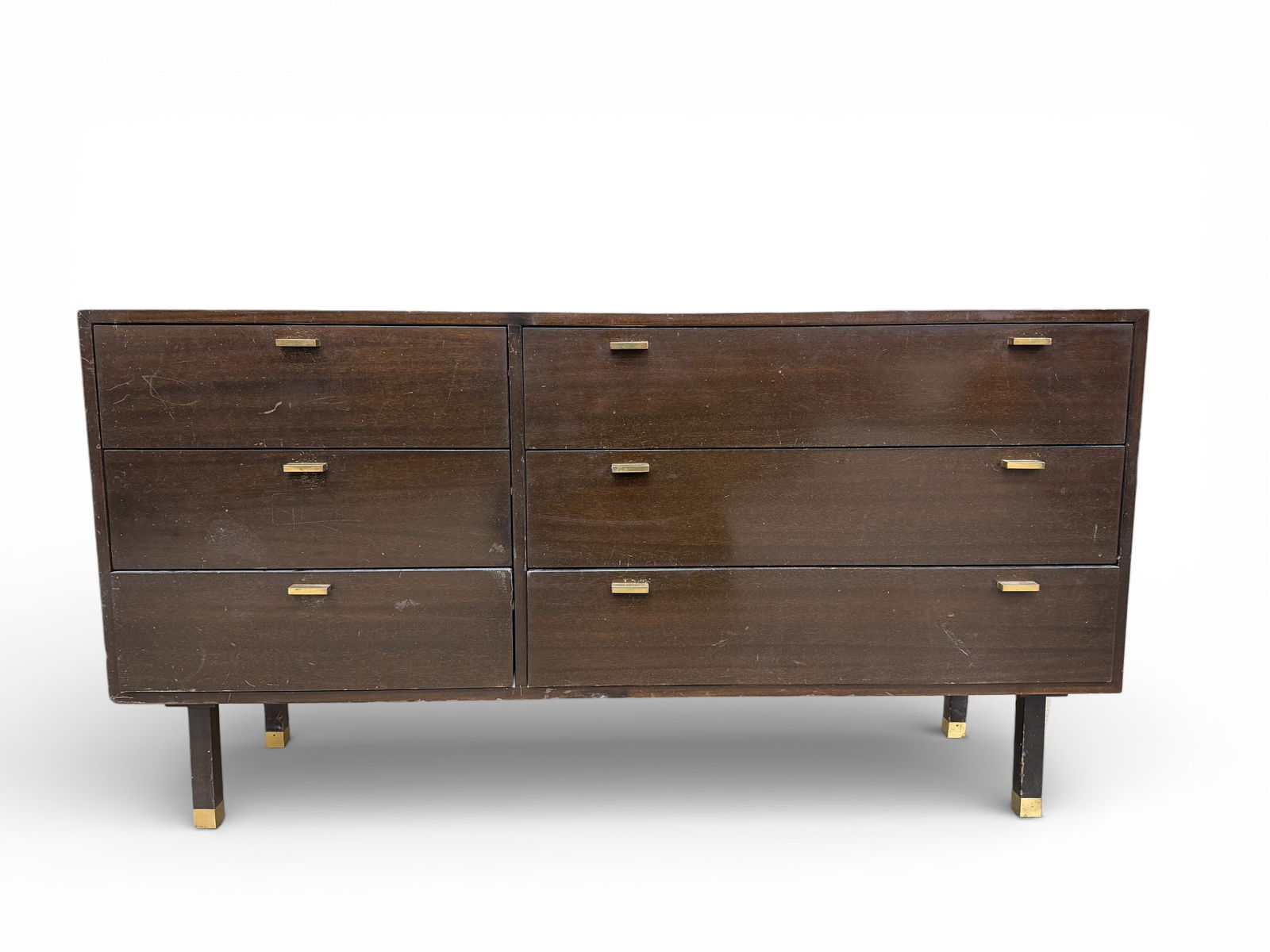 Harvey Probber Long Dresser: A Harvey Probber long 6-drawer-dresser with brass hardware and brass-capped legs. Dimensions: H:32" W:59" D:19"