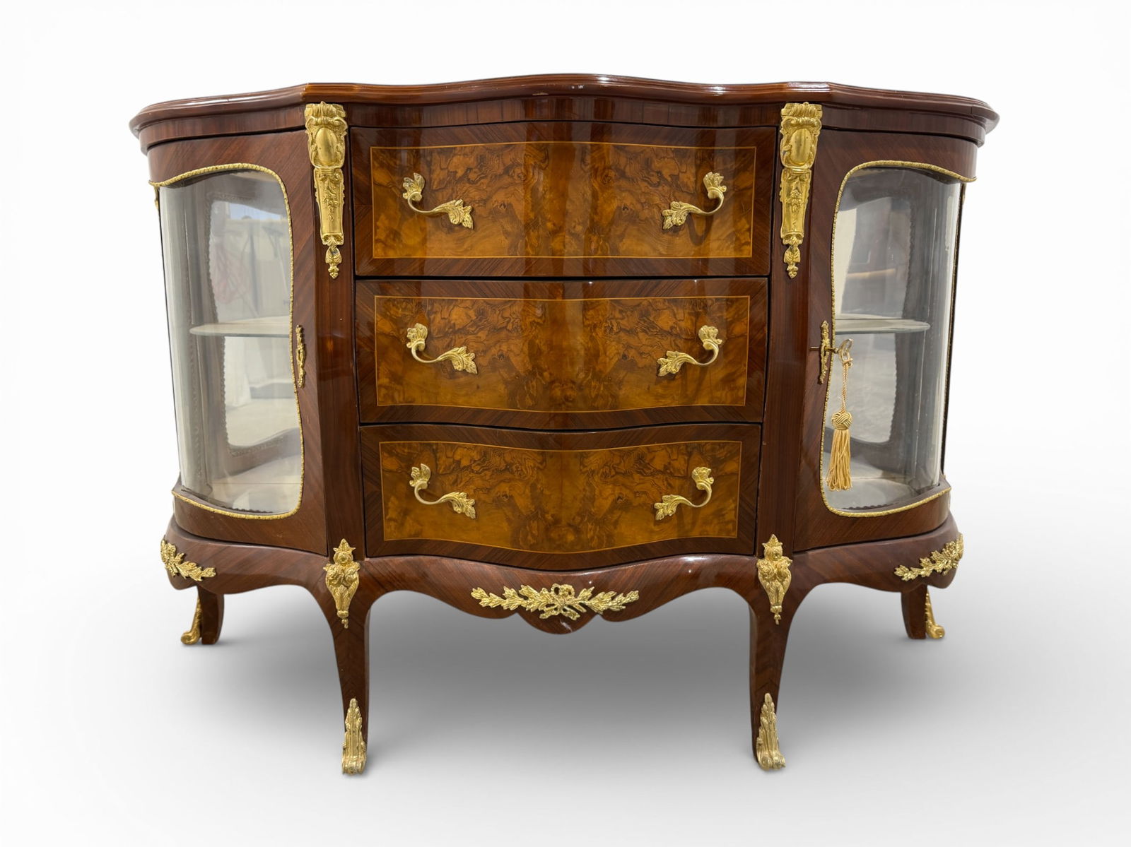 French Style Sideboard with Glass Displays: A French style sideboard with glass display cabinets. Key included as the glass cabinets lock. H:35.5" W: 53" D:19