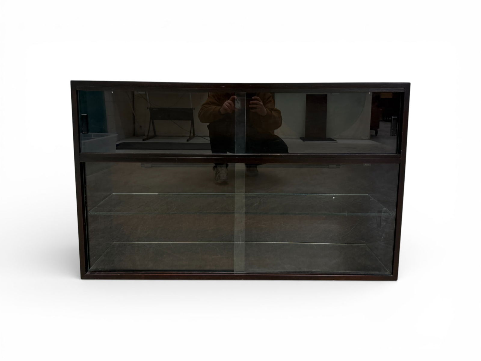 Mid Century Style Glass Door Cabinet: A mid century modern style glass door cabinet by Jasper Wood Products Co. This dark wood finish cabinet has 4 sliding glass doors for storage or display. the lower cabinet features a mirrored base. Gl