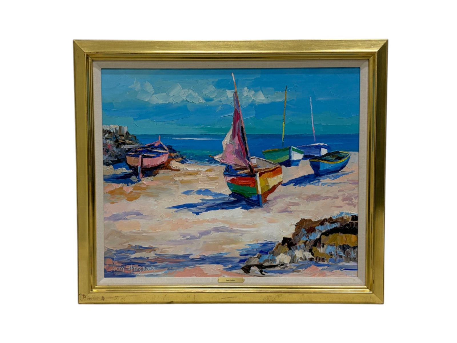 Don Hazen Oil on Canvas Boats on the Beach: Don Hazen (American, 1933). Oil on canvas, boats on the beach. Signed lower left. In a gilt frame. Dimensions: H:29.5" W:34.25" D:2.5", sight size 23.25" x 28"