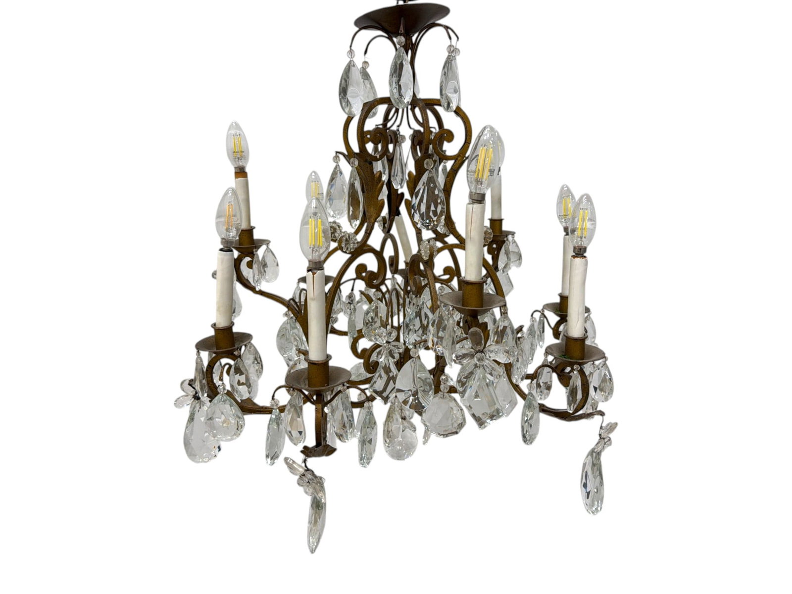 French Bronze and Crystal Chandelier: French Bronze and Crystal 9-light Chandelier. Each piece of crystal is intricately hand wired to the fixture. Dimensions: H:31" W:31" D:31"