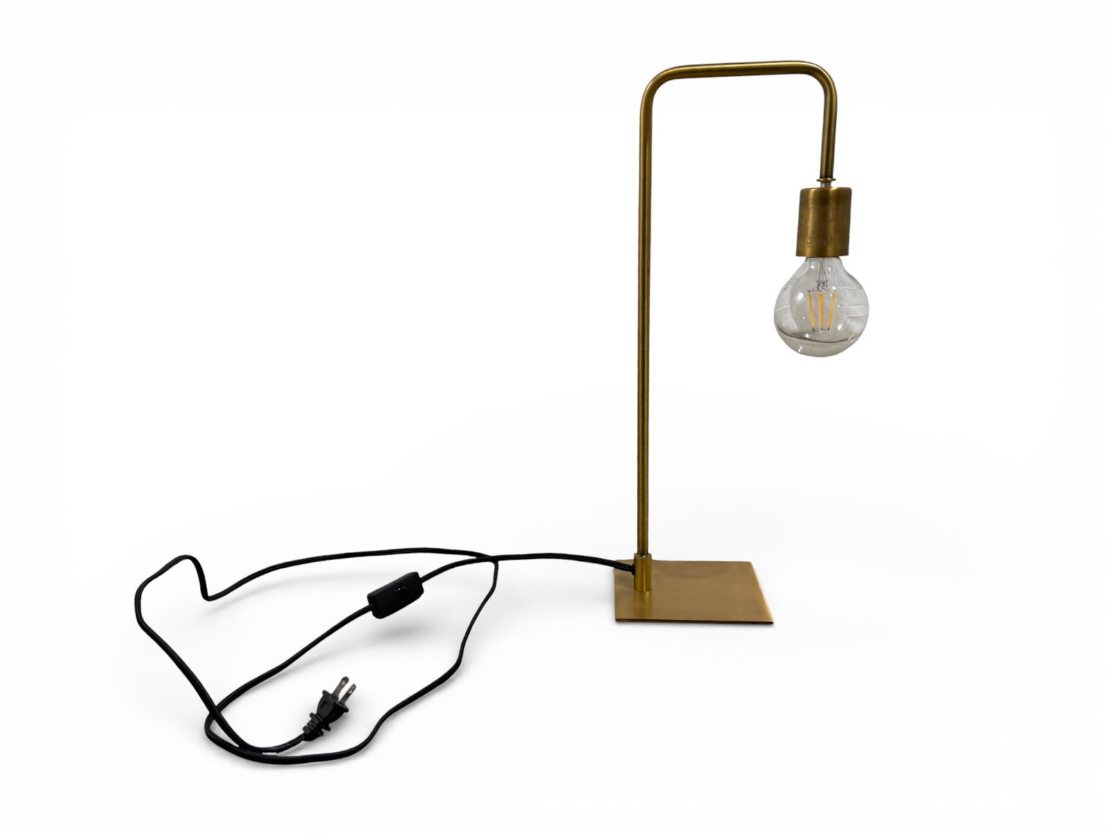 CB2 Brass Arc Table Lamp: An arched neck brass finish table lamp by CB2 Dimensions: H: 20" W: 6" D: 5"