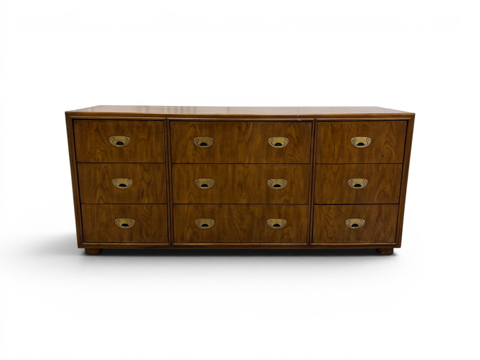 Drexel Passage Campaign Style Dresser: Drexel Heritage "Passage" campaign style 9 drawer dresser. Marked Drexel inside top drawer and on back panel. Dimensions: H: 29.25" W: 66" D: 19"