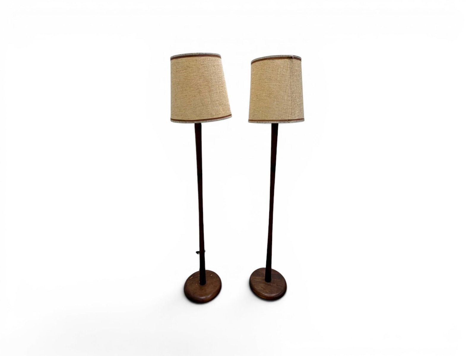 Pair Modern Teak Floor Lamps: Pair of modern teak floor lamps. Dimensions to tops of finials, not including shades: H: 59.5" W: 11" D: 11"