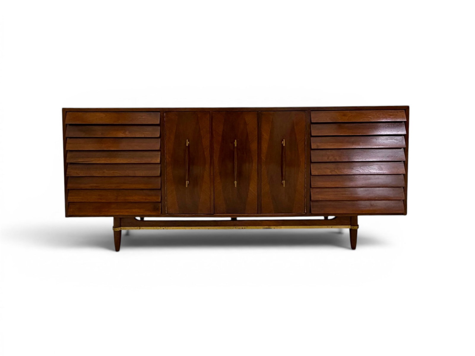 American of Martinsville Triple Dresser: American of Martinsville triple dresser. 3 drawers on each side, central cabinet doors with 3 interior drawers. Marked American of Martinsville inside top drawer. Dimensions: H: 30.25" W: 70" D: 18.75