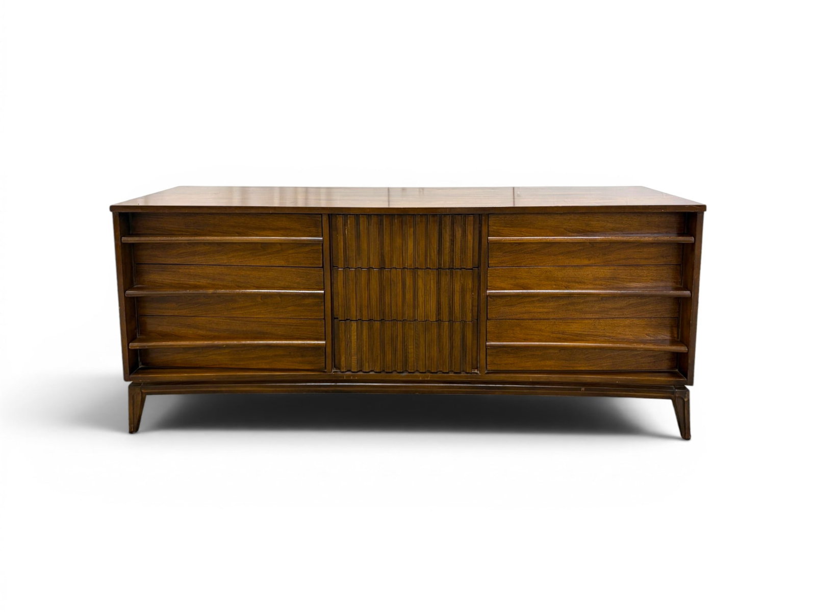 Concave Walnut Nine Drawer Dresser: Mid-century curved front concave dresser. Walnut, 9 drawers. Dimensions: H: 31" W: 72.75" D: 20"