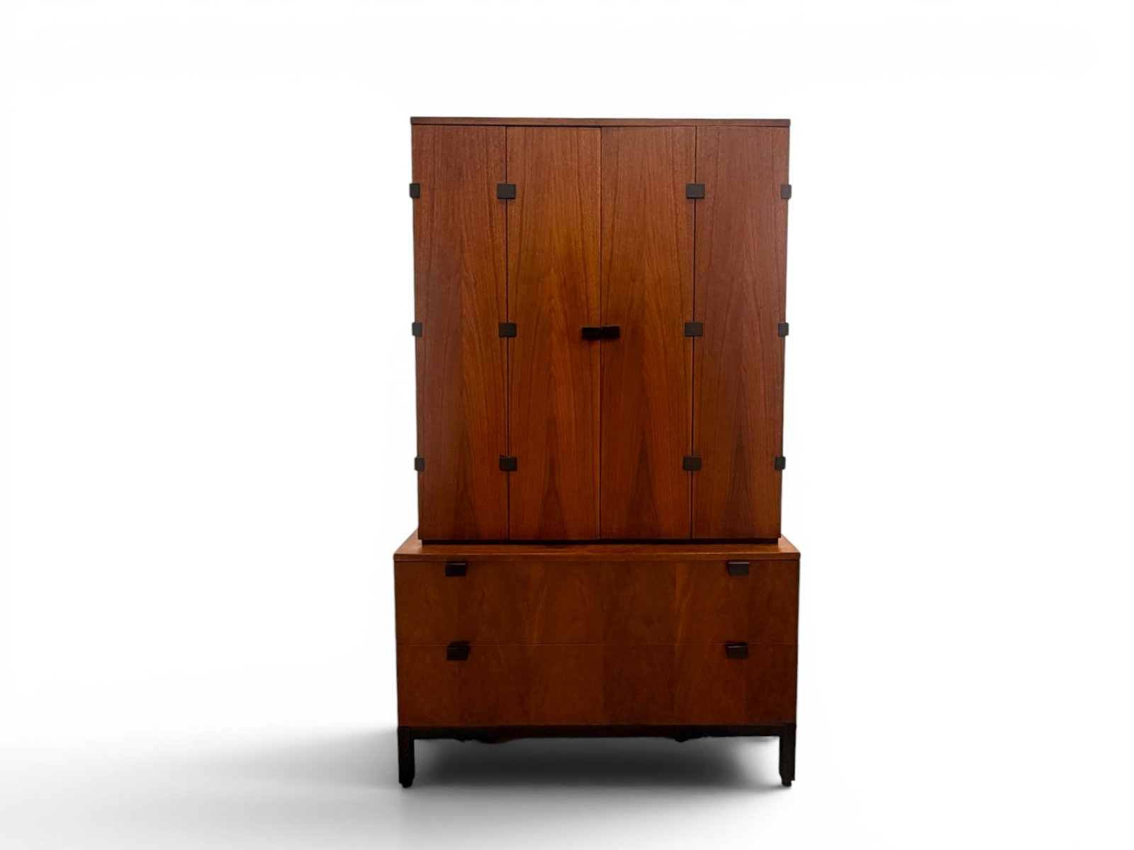 Milo Baughman for Directional Gentleman's Chest: Milo Baughman for Directional, 2 part gentleman's chest. Walnut, with ebonized base and pulls. Top cabinet, with folding doors and fitted interior with shelves, dividers and 2 drawers. Lower section w
