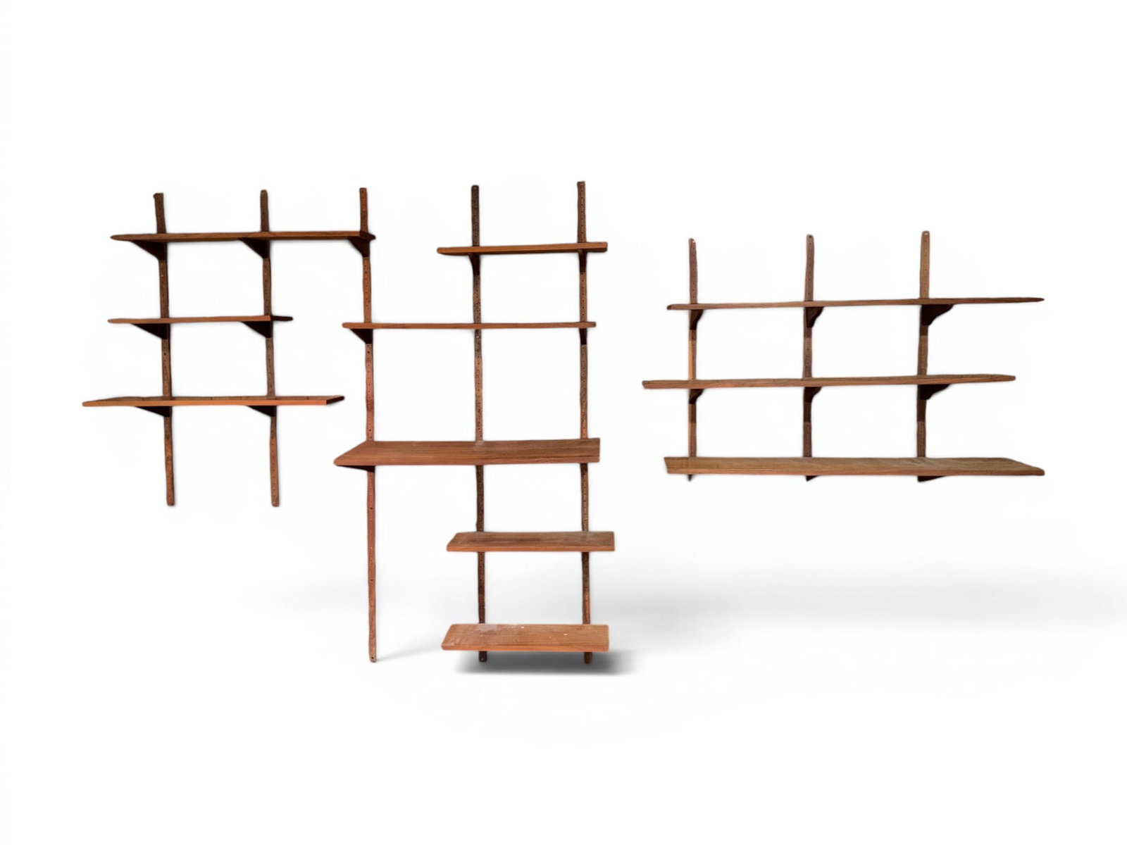 Poul Cadovius Style Wall Mounted Shelf System: Poul Cadovius style wall-mounted shelf system. Unmarked. Includes: 3 36" wall supports 2 48" wall supports 3 72" wall supports 2 shelves 48" x 8" x .75" 1 shelf 48" x 10" x .75" 4 shelves 24" x 8" x .