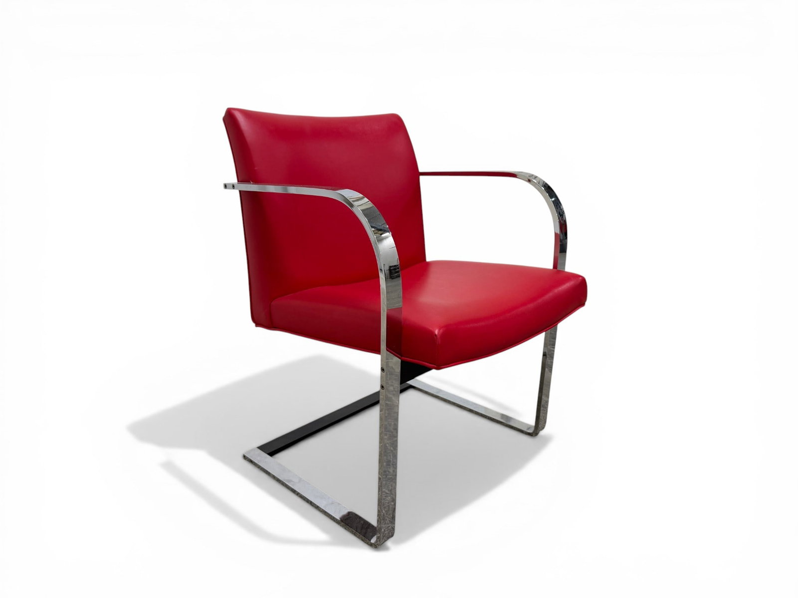 Brno Style Chrome & Red Vinyl Chair: A Brno Style Chrome & Red Vinyl Chair Dimensions: H:31" W:23" D:23" Seat Height:17"