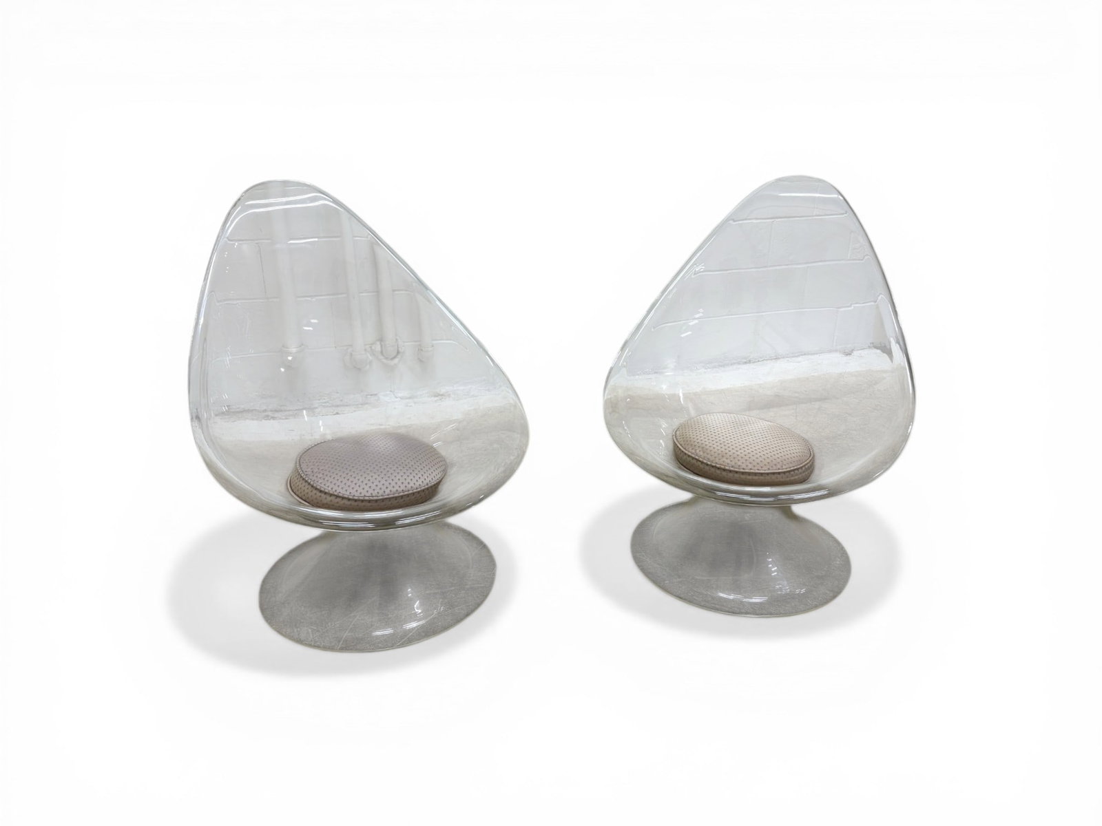 Pair of Erwine & Estelle Laverne Lily Chairs: Pair of Erwine & Estelle Laverne "Lily" chairs from the Invisible Group series. Acrylic teardrop form with round bases with removable upholstered cushions. Dimensions: H: 36.75" W: 29.25" D: 35",seat