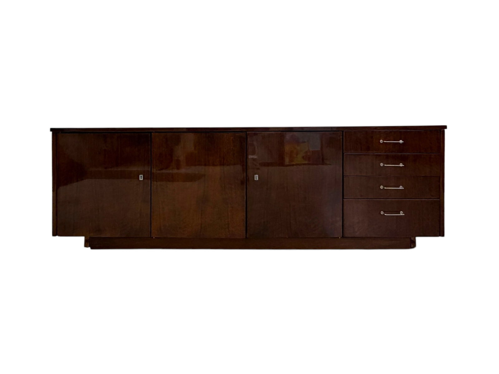 Riga Soviet-Era Credenza: Riga Soviet-era credenza. Mahogany veneer, chrome hardware. 4 drawers, 3 drawers with interior shelves. Latvian / Russian label on back panel. Dimensions: H: 24.75" W: 75" D: 19.75"