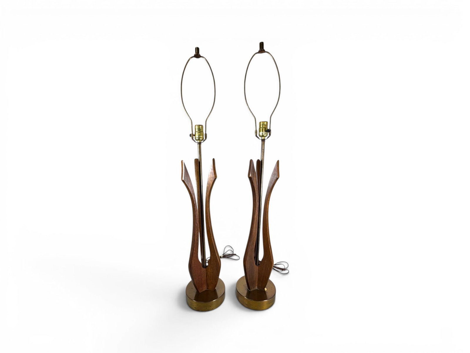 Pair of Mid-Century Modern Walnut & Brass Lamps: Pair of mid-century modern sculptural walnut and brass table lamps. Dimensions to tops of finials without shades: H: 37.25" W: 6.25" D: 6.25"