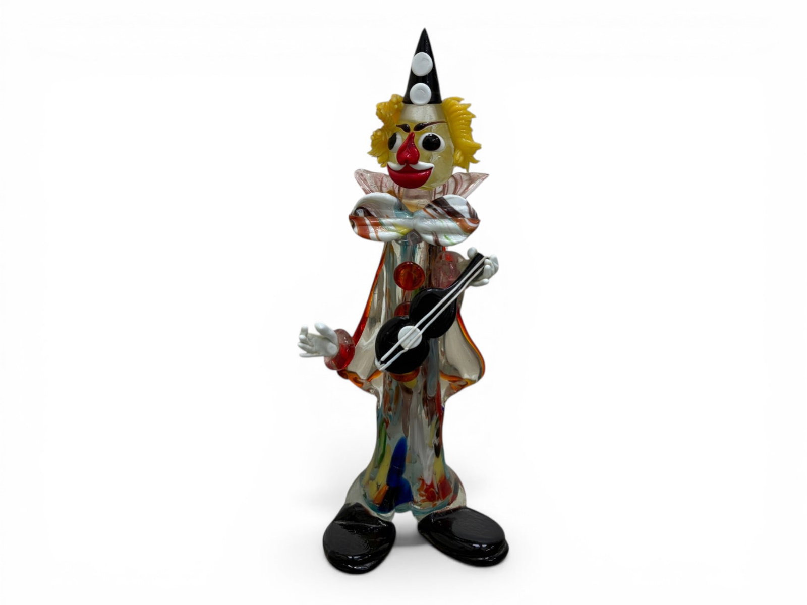 Italian Murano Glass Clown Sculpture: A Italian Murano Glass Clown Sculpture crafted through traditional Venetian glassblowing techniques. Dimensions: H:15.25" W:5.25" D:5"