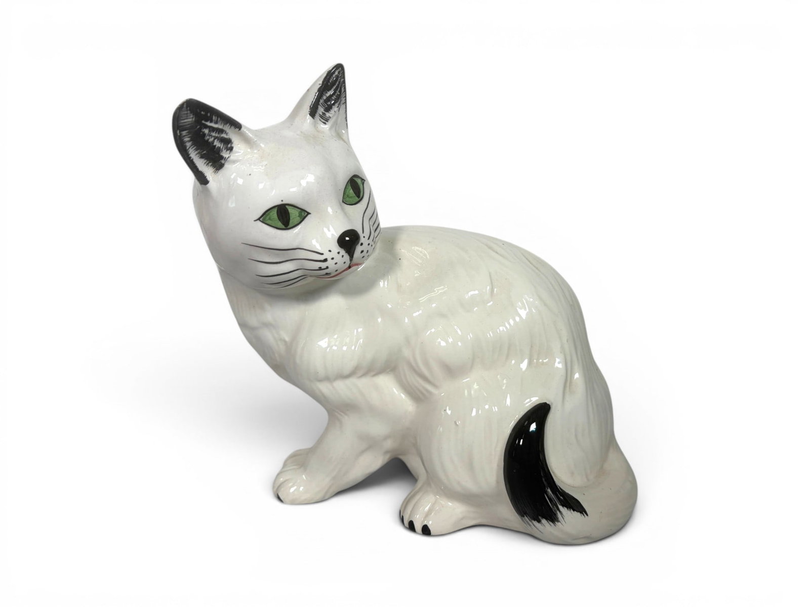 Italian Porcelain Cat Figure: Italian porcelain cat figure. Marked Italy on the underside. Dimensions: H: 6.625" W: 7.5" D: 4.25"